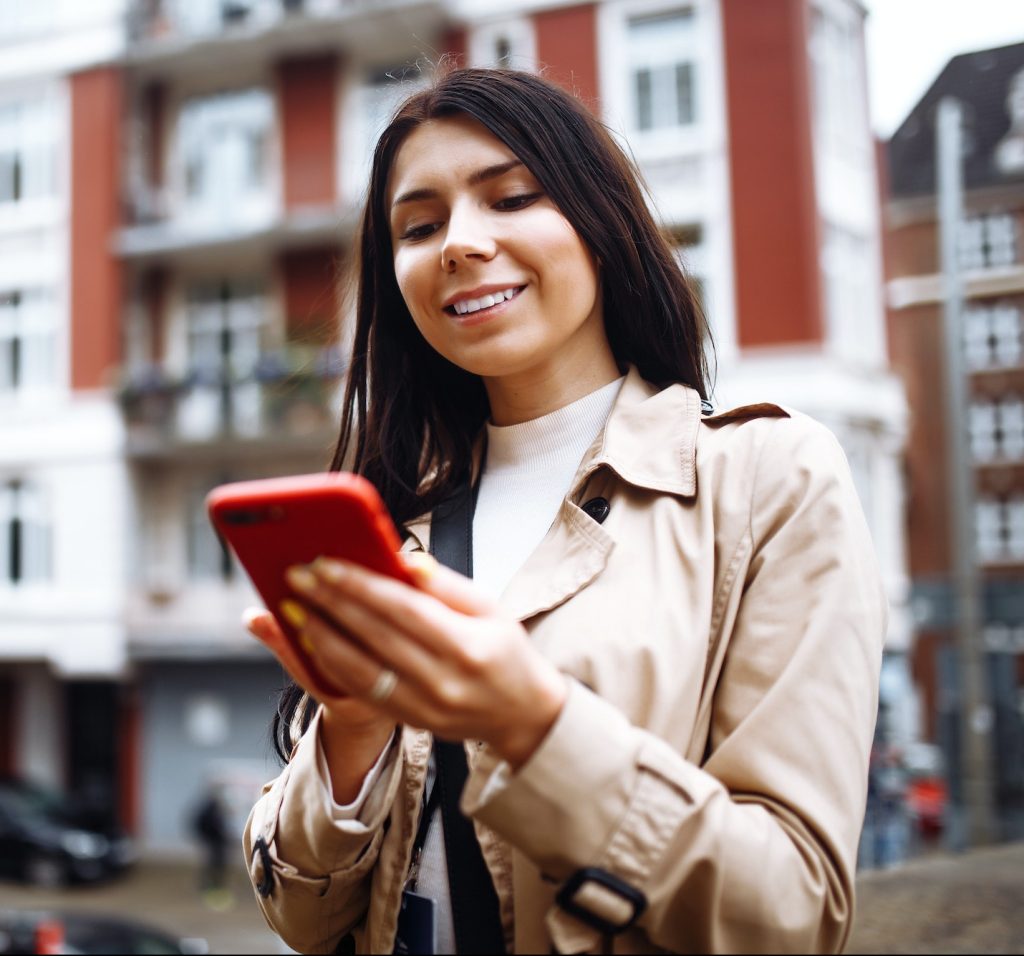 Beautiful stylish girl photographs scandinavian architecture. Travelling, lifestyle, adventure