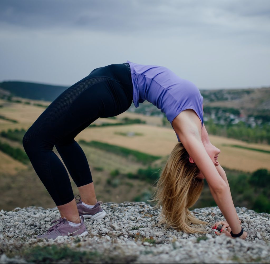 Practicing yoga in nature. Active living concept. Taking care of your health.